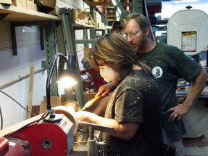 Assisting a student with cutting techniques
